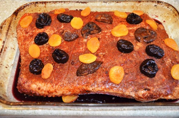 Put in brisket, and put more dried fruit on top. Add wine